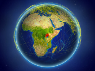 Uganda from space on planet Earth with digital network representing international communication, technology and travel.