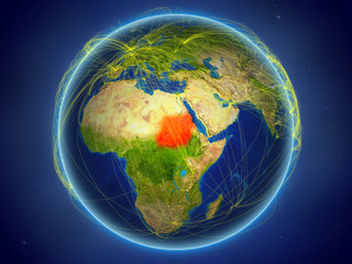 Sudan from space on planet Earth with digital network representing international communication, technology and travel.