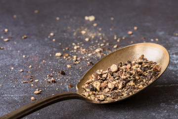 Fresh Ground Black Pepper on a Vintage Spoon