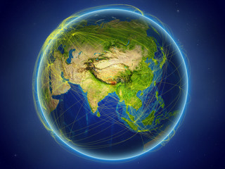 Bhutan from space on planet Earth with digital network representing international communication, technology and travel.