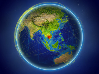 Cambodia from space on planet Earth with digital network representing international communication, technology and travel.
