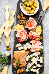 Cheese variety,  olives,  Prosciutto and wine