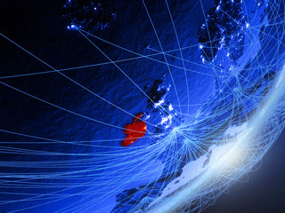 Ireland on green model of planet Earth with network at night. Concept of blue digital technology, communication and travel.