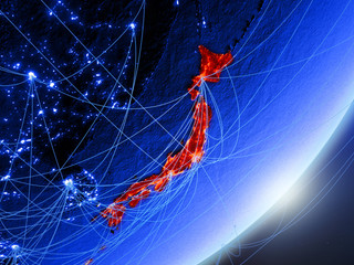 Japan on green model of planet Earth with network at night. Concept of blue digital technology, communication and travel.