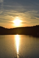 Forest, lake and sun set