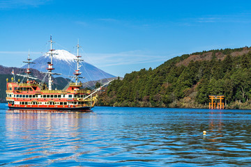 Mountain Fuji and Lake Ashi with Hakone temple and sightseeing boat in autumn
