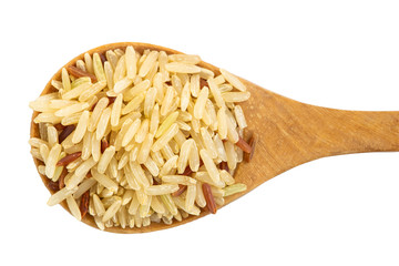 Brown rice on wooden spoon isolated on white background with clipping path