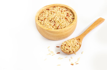 Brown Jusmine Rice on wooden bowl and wooden spoon on white background .copy,apace.