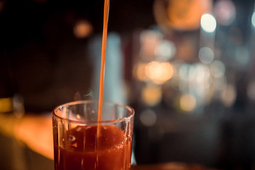 Bartender making alcoholic cocktail, summer cocktail in bar