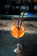Ready alcoholic cocktail on the background of spice bars in a luxury bar, club, night club, restaurant, pub, evening, weekend