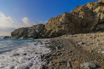 lonely bay with rugged rock formation