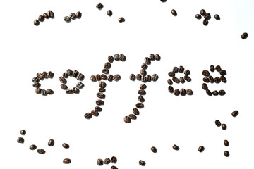 Dark roasted coffee bean made in coffee word on white background