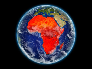 Africa from space on realistic model of planet Earth with detailed planet surface and clouds. Continent highlighted in red.