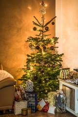 Merry Christmas beautiful living room tree setup aith gifts decorated for Happy Holidays at home