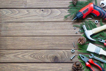 Merry Christmas and Happy new year handy construction tools background concept. Hammer, wrenches,...