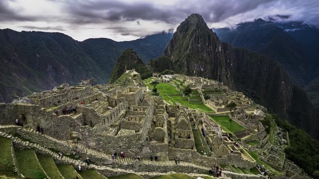 4k Timelapse movie film clip of Machu Picchu in Peru. Machu Picchu is a Inca citadel situated on a mountain ridge in the Cusco Region in Sacred Valley.