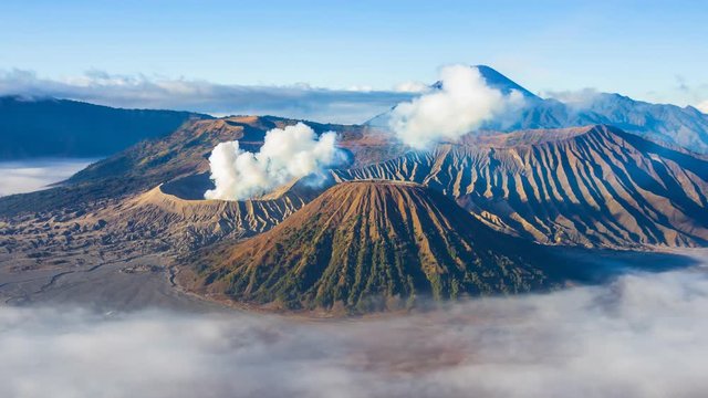 Beautiful Volcano and Misty floating Around Hillside , Landmarks Nature Travel Place Of Indonesia 4K Time Lapse (pan shot)