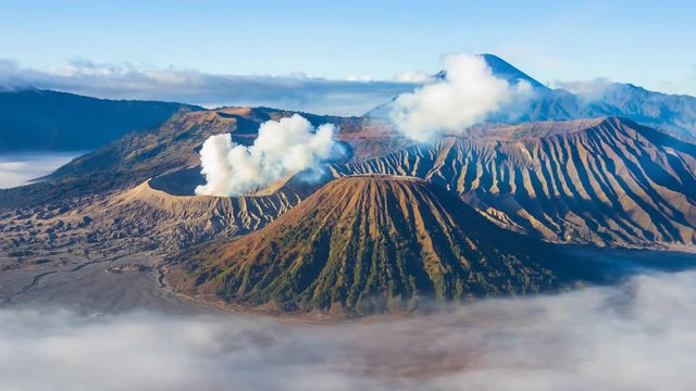Beautiful Volcano and Misty floating Around Hillside , Landmarks Nature Travel Place Of Indonesia 4K Time Lapse (zoom in)