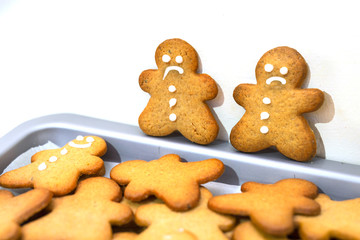 horizontal image of a plate with Christmas cookies in the shape of a gingerbread man