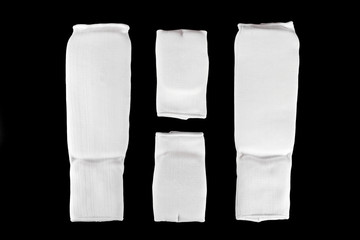 Karate protective gears set isolated on a black background.