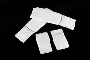 Karate protective gears set isolated on a black background.