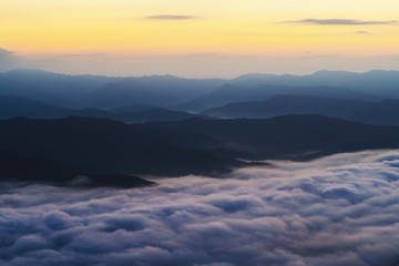  sunset overlooking mountains with Mist
