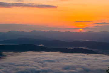  sunset overlooking mountains with Mist