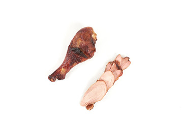 roast turkey leg and sliced turkey meat isolated on white background.