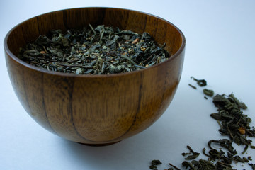 dry green tea in a bowl