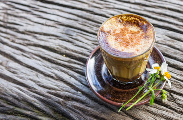 Latte Coffee and Daisy Flower and Spoon on Wood Table on Green Tree Background Right Zoom