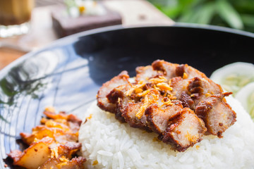 Thai Food Fried Pork with Garlic with Cucumber and Chocolate Brownie Cake and Coffee Right