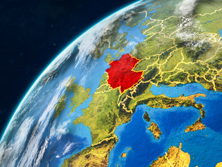 Germany on realistic model of planet Earth with country borders and very detailed planet surface and clouds.