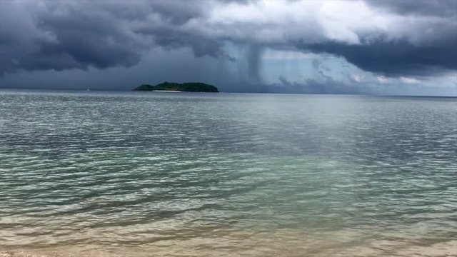 Storm passing over Dalutan Island in the Visayan Sea, off of Biliran Island in the Philippines.