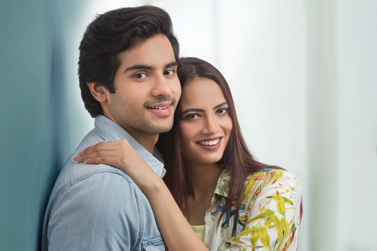 Portrait of young couple hugging