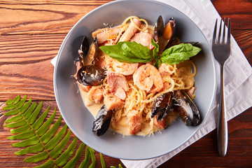 Seafood pasta with mussels, squid, salmon, prawns