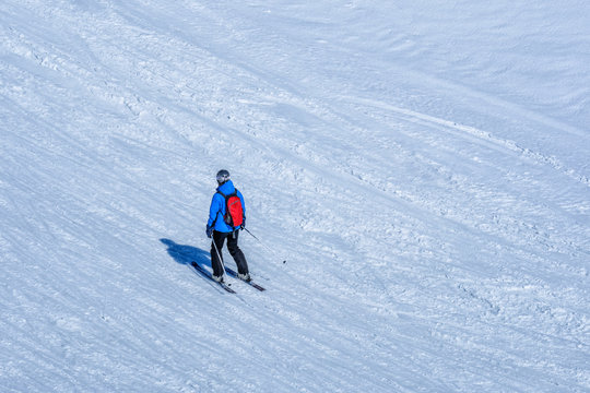 Skiers skiing at Kleine Scheidegg on a beautiful sunny day, Switzerland