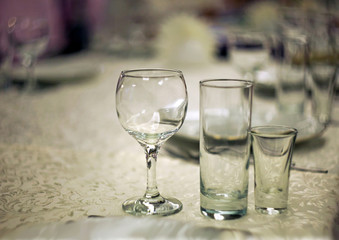 Wine glasses on the table in the restaurant with a beautiful blurred background and bokeh