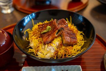 Delicious Unadon, Kabayaki, grilled ell with sweet sauce and egg on cooked white rice, popular japanese dish, Kyoto