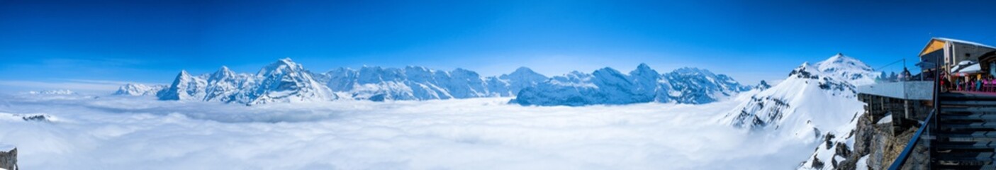 Stunning Panoramic view snow mountain of the Swiss Skyline from Schilthorn Piz Gloria, Switzerland