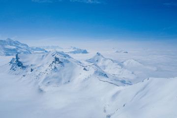 Fototapeta na wymiar Stunning view of the snow mountain the Swiss Skyline from Schilthorn Piz Gloria, Switzerland