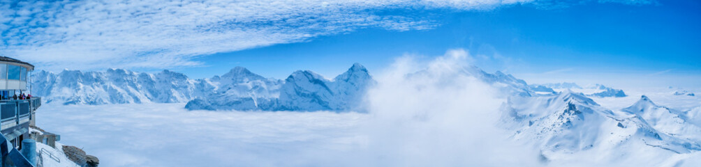 Stunning Panoramic view snow mountain of the Swiss Skyline from Schilthorn Piz Gloria, Switzerland
