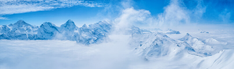 Stunning Panoramic view snow mountain of the Swiss Skyline from Schilthorn Piz Gloria, Switzerland