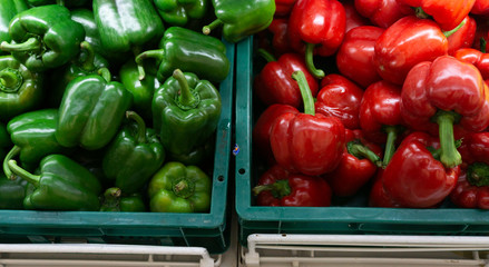 Green and red Bell Pepper raw many on the basket in market background and department store. displayed is sale, Vegetables for health. Foods concept.