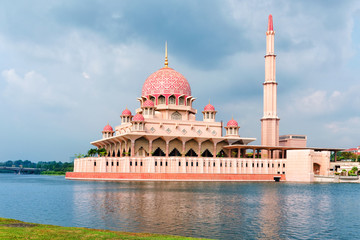 Fototapeta na wymiar General view of the Putra Mosque with Putrajaya Lake, day with dramatic sky.