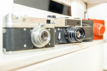 old cameras in soft-focus in the background