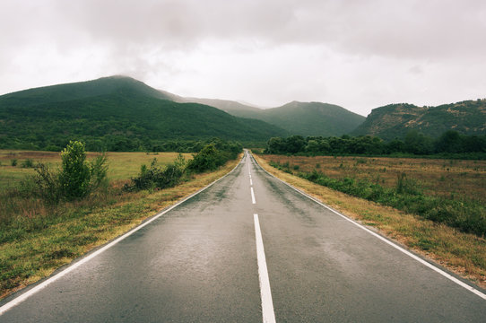 Wet Asphalt Road At Rainy Day