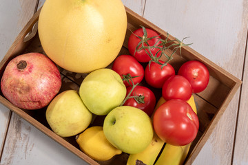 tray with various seasonal fruits and vegetables