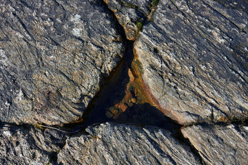 cracks forming triangle on bedrock