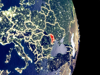 Satellite view of Moldova at night with visible bright city lights. Extremely fine detail of the plastic planet surface.