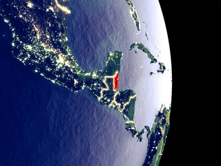 Satellite view of Belize at night with visible bright city lights. Extremely fine detail of the plastic planet surface.